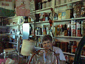 Elsie in behind the counter.